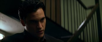 Movie still from “The Yards” (2000), directed by James Gray – A person wearing a black shirt; Close Up shot, Low angle