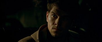 Movie still from “The Yards” (2000), directed by James Gray – A person wearing a hooded jacket; Close Up shot, Over the shoulder angle