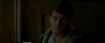 Movie still from “The Yards” (2000), directed by James Gray – A man with a beard is looking at the camera; Close Up shot, Low angle