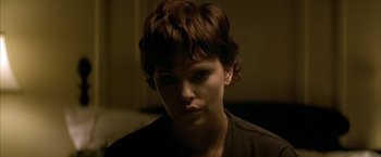 Movie still from “The Yards” (2000), directed by James Gray – A person with short brown hair; Close Up shot, Over the shoulder angle