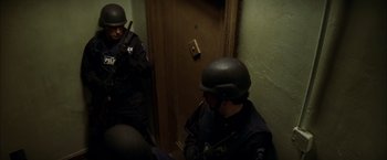 Movie still from “The Yards” (2000), directed by James Gray – A group of men in black suits and helmets; Medium shot, Low angle