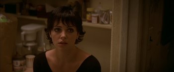 Movie still from “The Yards” (2000), directed by James Gray – A person with short black hair; Close Up shot, Over the shoulder angle