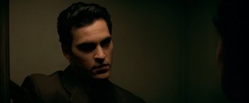 Movie still from “The Yards” (2000), directed by James Gray – A person wearing a black shirt; Close Up shot, Low angle