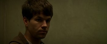 Movie still from “The Yards” (2000), directed by James Gray – A person wearing a shirt; Close Up shot, Over the shoulder angle