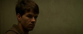 Movie still from “The Yards” (2000), directed by James Gray – A person's face in a room; Close Up shot, Over the shoulder angle