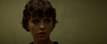 Movie still from “The Yards” (2000), directed by James Gray – A person with short brown hair; Close Up shot, Over the shoulder angle