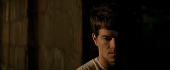 Movie still from “The Yards” (2000), directed by James Gray – A man with a beard is looking at the camera; Close Up shot, Low angle