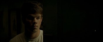 Movie still from “The Yards” (2000), directed by James Gray – A young man in a white shirt is looking at the camera; Close Up shot, Low angle