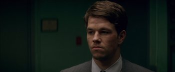 Movie still from “The Yards” (2000), directed by James Gray – A person wearing a suit and tie; Close Up shot, Over the shoulder angle