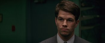 Movie still from “The Yards” (2000), directed by James Gray – A person wearing a suit and tie; Close Up shot, Over the shoulder angle
