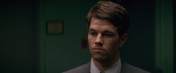 Movie still from “The Yards” (2000), directed by James Gray – A person wearing a suit and tie; Close Up shot, Over the shoulder angle