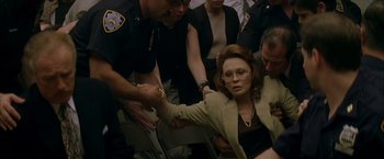 Movie still from “The Yards” (2000), directed by James Gray – A group of people standing next to each other; Medium shot, High angle