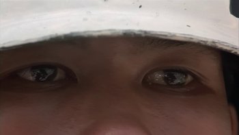 Movie still from “The Year of Living Dangerously” (1982), directed by Peter Weir – View of a person's eyes looking into the camera; Extreme Close Up shot, High angle