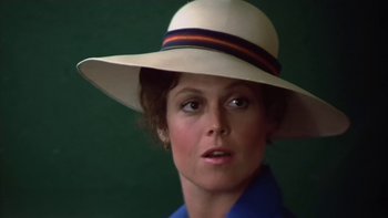 Movie still from “The Year of Living Dangerously” (1982), directed by Peter Weir – A person wearing a hat; Close Up shot, Low angle