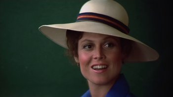 Movie still from “The Year of Living Dangerously” (1982), directed by Peter Weir – A person wearing a hat; Close Up shot, Low angle