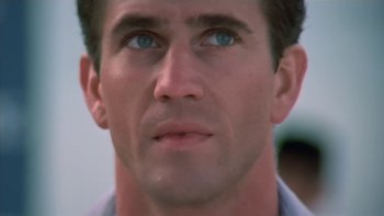 Movie still from “The Year of Living Dangerously” (1982), directed by Peter Weir – A man's face with blue eyes; Close Up shot, Low angle