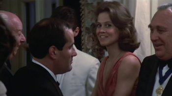 Movie still from “The Year of Living Dangerously” (1982), directed by Peter Weir – A man and a woman are talking to each other; Close Up shot, Over the shoulder angle