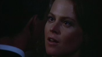 Movie still from “The Year of Living Dangerously” (1982), directed by Peter Weir – A woman's face in the dark; Close Up shot, Over the shoulder angle