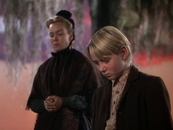 Movie still from “The Yearling” (1946), directed by Clarence Brown – Two young people standing next to each other; Medium shot, Low angle