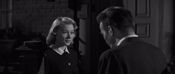 Movie still from “The Young Lions” (1958), directed by Edward Dmytryk – A man and a woman are looking at one another; Close Up shot, Over the shoulder angle