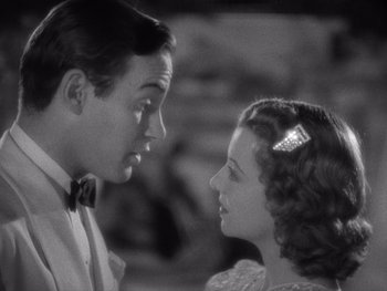 Movie still from “The Young in Heart” (1938), directed by Gilbert Pratt – A man and a woman looking at one another; Close Up shot, High angle