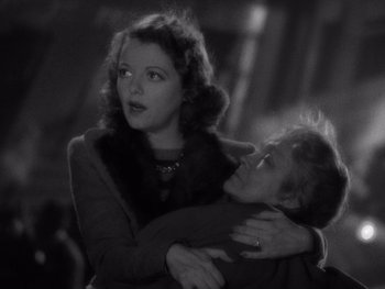 Movie still from “The Young in Heart” (1938), directed by Gilbert Pratt – An old photo of a woman holding a young boy; Medium shot, Low angle