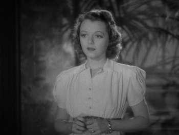 Movie still from “The Young in Heart” (1938), directed by Gilbert Pratt – An old black and white photo of a woman; Close Up shot, High angle