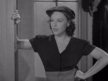 Movie still from “The Young in Heart” (1938), directed by Gilbert Pratt – A black and white photo of a woman in a hat; Medium shot, High angle