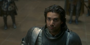 Movie still from “House of the Dragon” (2022), created by George R.R. Martin – A person wearing a suit of armor; Close Up shot, High angle
