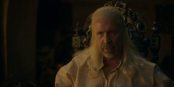 Movie still from “House of the Dragon” (2022), created by George R.R. Martin – A person with long white hair; Close Up shot, Over the shoulder angle