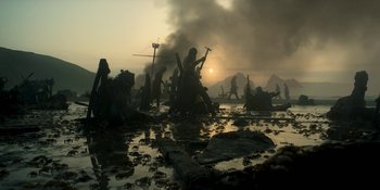 Movie still from “House of the Dragon” (2022), created by George R.R. Martin – A group of people standing on top of a beach; Extreme Wide shot, Low angle