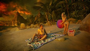 Movie still from “The Zero Theorem” (2013), directed by Terry Gilliam – A man and a woman on the beach; Extreme Wide shot, High angle