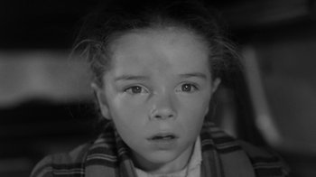Movie still from “Them!” (1954), directed by Gordon Douglas – A little girl is looking into the camera; Close Up shot, High angle