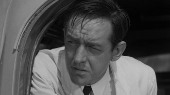 Movie still from “Them!” (1954), directed by Gordon Douglas – Black and white photograph of a man looking sad; Close Up shot, High angle