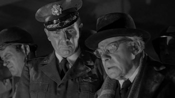 Movie still from “Them!” (1954), directed by Gordon Douglas – A black and white photo of two men in military uniforms; Close Up shot, Low angle