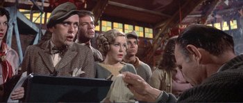 Movie still from “They Shoot Horses, Don't They?” (1969), directed by Sydney Pollack – A group of people sitting in front of a window; Medium shot, Low angle