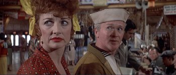 Movie still from “They Shoot Horses, Don't They?” (1969), directed by Sydney Pollack – A man and a woman standing next to each other; Close Up shot, Over the shoulder angle