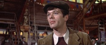 Movie still from “They Shoot Horses, Don't They?” (1969), directed by Sydney Pollack – A person wearing a suit and hat; Close Up shot, Low angle