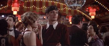 Movie still from “They Shoot Horses, Don't They?” (1969), directed by Sydney Pollack – A man and a woman are standing in front of each other; Medium shot, Low angle