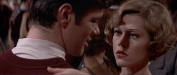 Movie still from “They Shoot Horses, Don't They?” (1969), directed by Sydney Pollack – A man and a woman looking at one another; Close Up shot, Over the shoulder angle