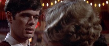 Movie still from “They Shoot Horses, Don't They?” (1969), directed by Sydney Pollack – A man and a woman's hair; Close Up shot, Over the shoulder angle