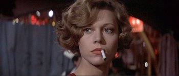 Movie still from “They Shoot Horses, Don't They?” (1969), directed by Sydney Pollack – A person smoking a cigarette; Close Up shot, Low angle