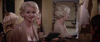 Movie still from “They Shoot Horses, Don't They?” (1969), directed by Sydney Pollack – A woman sitting in front of a mirror in front of a mirror; Close Up shot, Over the shoulder angle