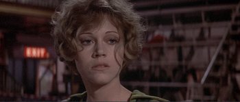 Movie still from “They Shoot Horses, Don't They?” (1969), directed by Sydney Pollack – A person wearing a green shirt; Close Up shot, Low angle