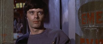 Movie still from “They Shoot Horses, Don't They?” (1969), directed by Sydney Pollack – A person wearing a sweatshirt; Close Up shot, Low angle