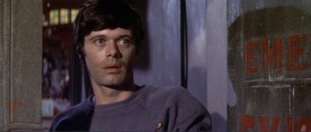 Movie still from “They Shoot Horses, Don't They?” (1969), directed by Sydney Pollack – A person wearing a sweater; Close Up shot, Low angle