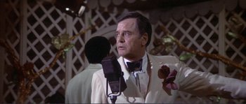 Movie still from “They Shoot Horses, Don't They?” (1969), directed by Sydney Pollack – An older man in a white suit and bow tie; Close Up shot, Low angle