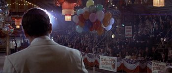 Movie still from “They Shoot Horses, Don't They?” (1969), directed by Sydney Pollack – A crowd of people sitting in front of balloons; Wide shot, Low angle