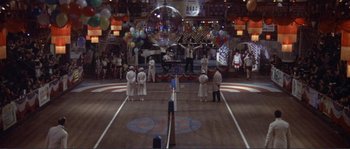Movie still from “They Shoot Horses, Don't They?” (1969), directed by Sydney Pollack – A group of people standing on a basketball court; Extreme Wide shot, High angle