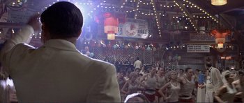 Movie still from “They Shoot Horses, Don't They?” (1969), directed by Sydney Pollack – A crowd of people sitting and standing in front of an audience; Wide shot, Over the shoulder angle